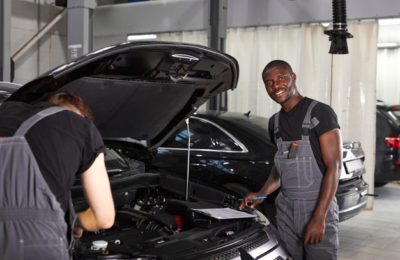 team-african-caucasian-men-working-auto-service-together_183219-2489
